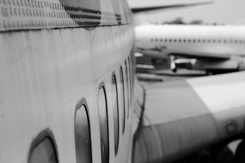 grayscale photo of airplane door XFzCE