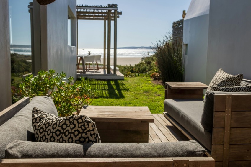 a couch and some chairs on a deck