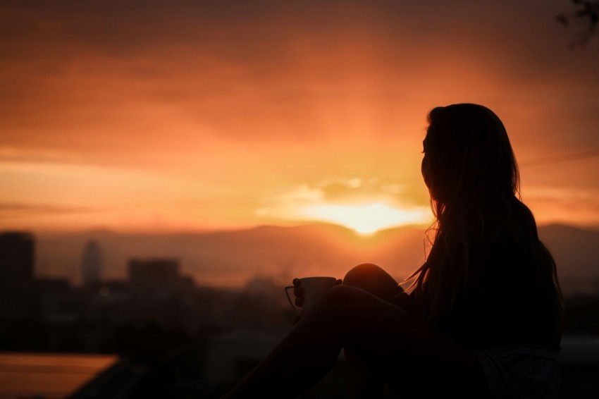 silhouette of woman during sunset aIA