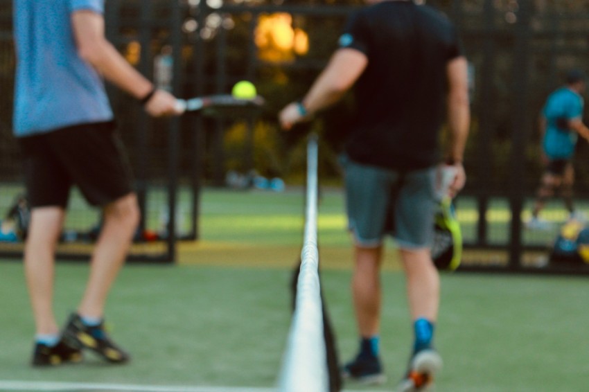 a person hitting a ball with a racket