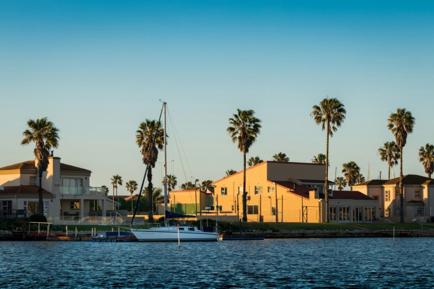 yellow concrete building beside body of water during daytime