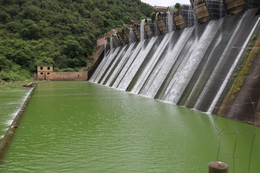 a large body of water with a dam in the background