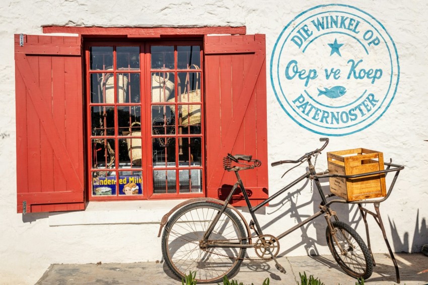 a bicycle is parked in front of a window