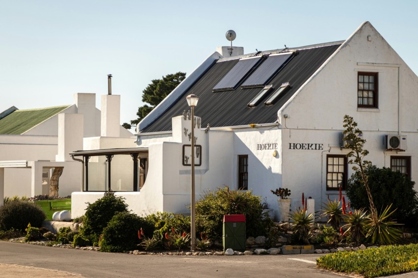 a large white house with a black roof