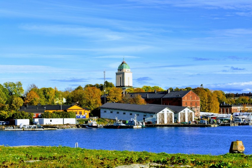 a body of water with a small town in the background