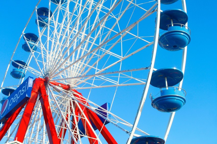 a ferris wheel with blue sky in the background