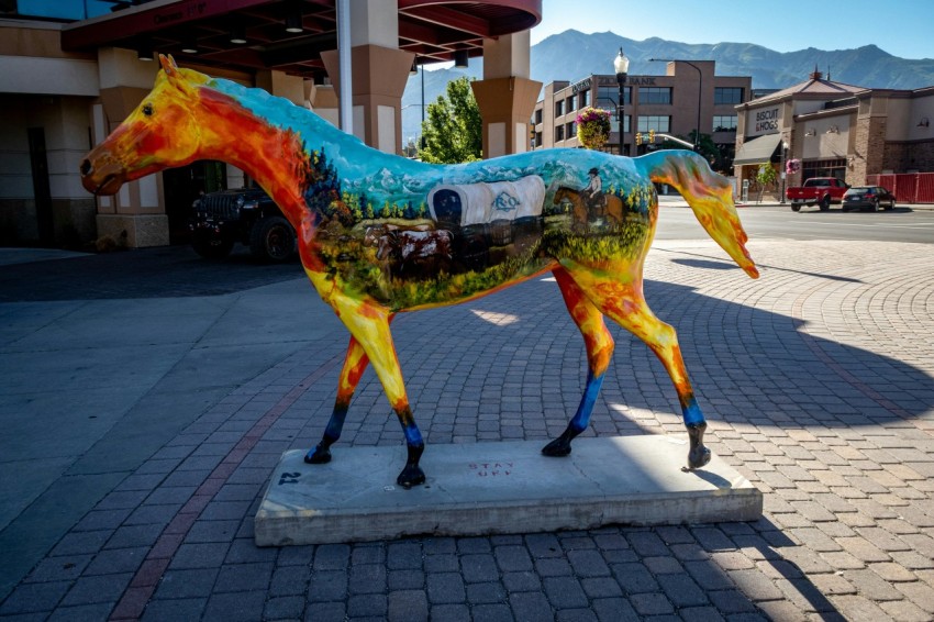 a statue of a horse on a city street