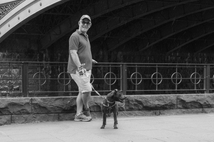 a man walking a dog on a leash