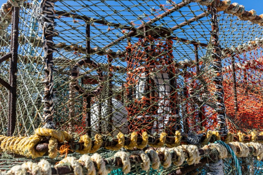 a bunch of fishing nets are stacked on top of each other ehaj_y1Y