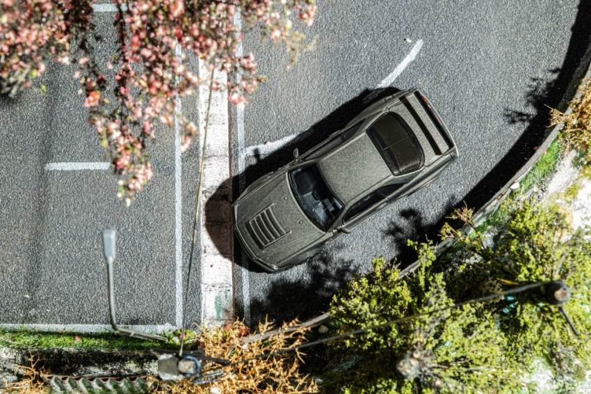 an overhead view of a car parked on the side of a road