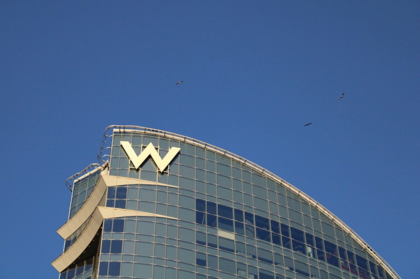 a very tall building with a very large w on its side