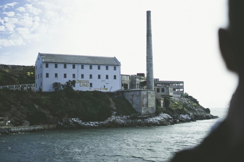 a person standing in front of a large building