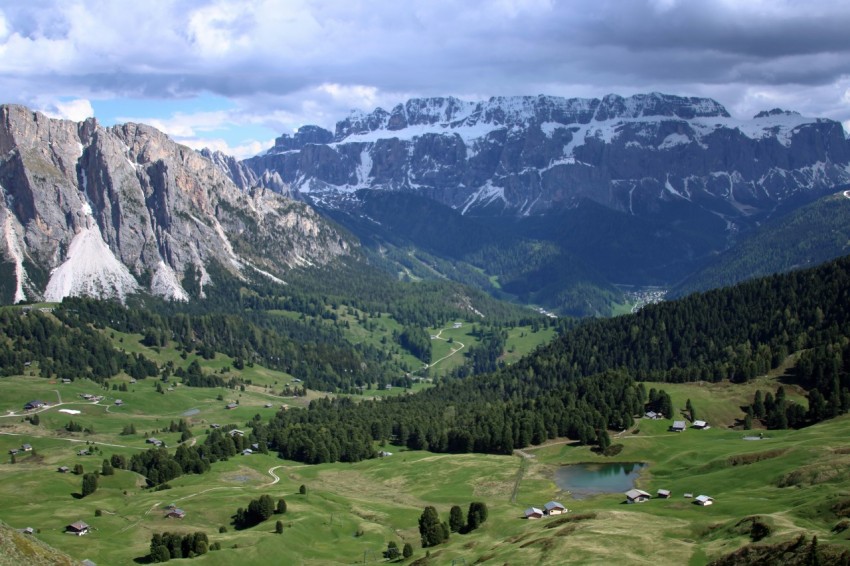 a view of a valley with mountains in the background