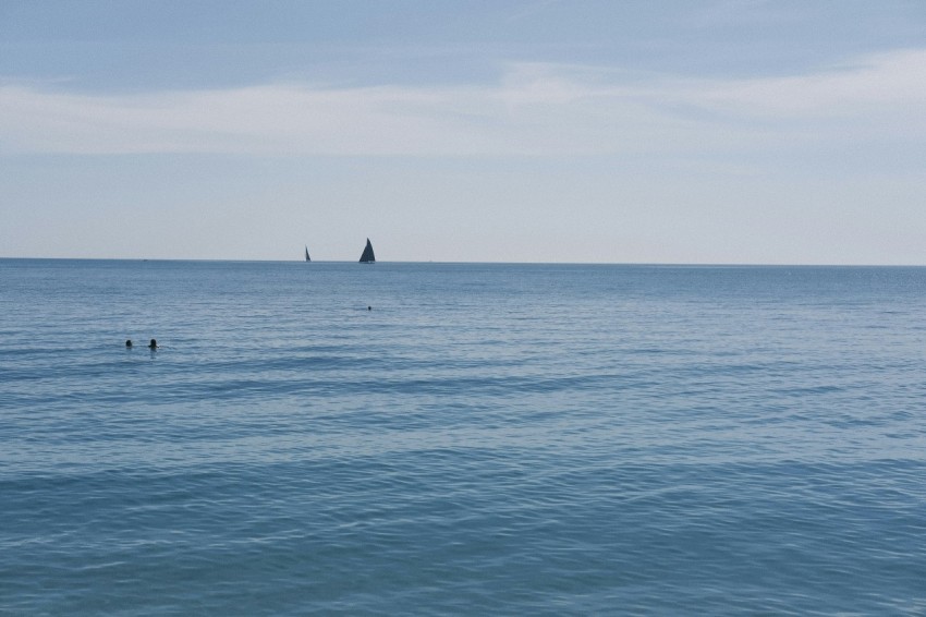 a body of water with a boat in the distance