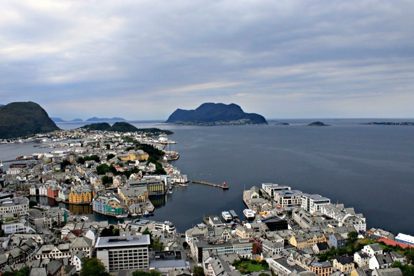 an aerial view of a city and a body of water