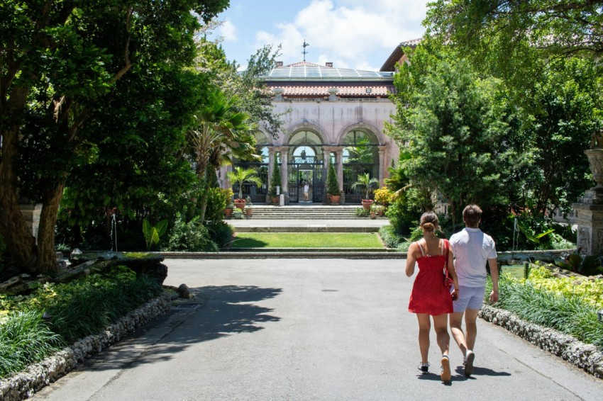 a man and a woman walking down a road