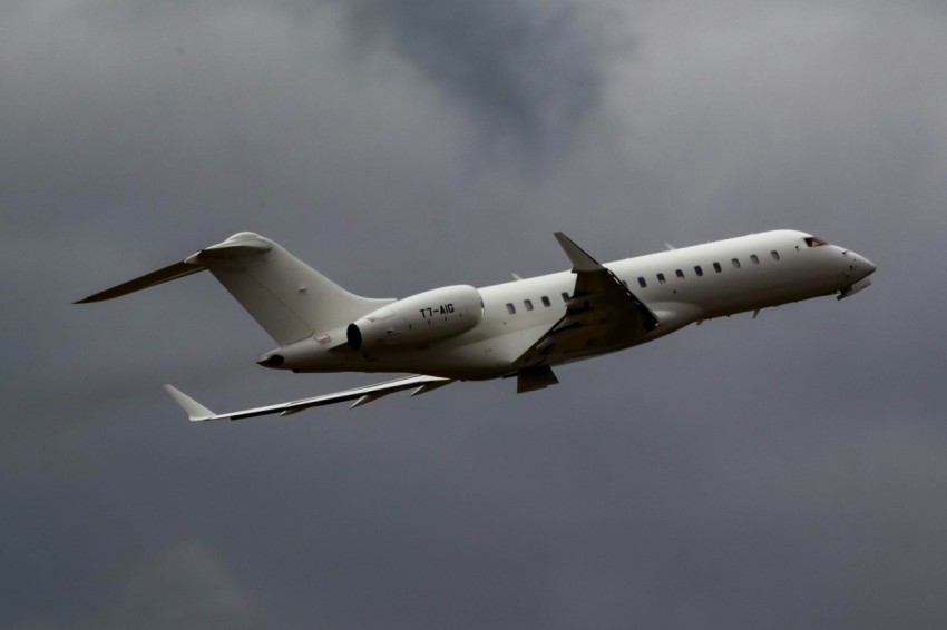 an airplane is flying through the cloudy sky