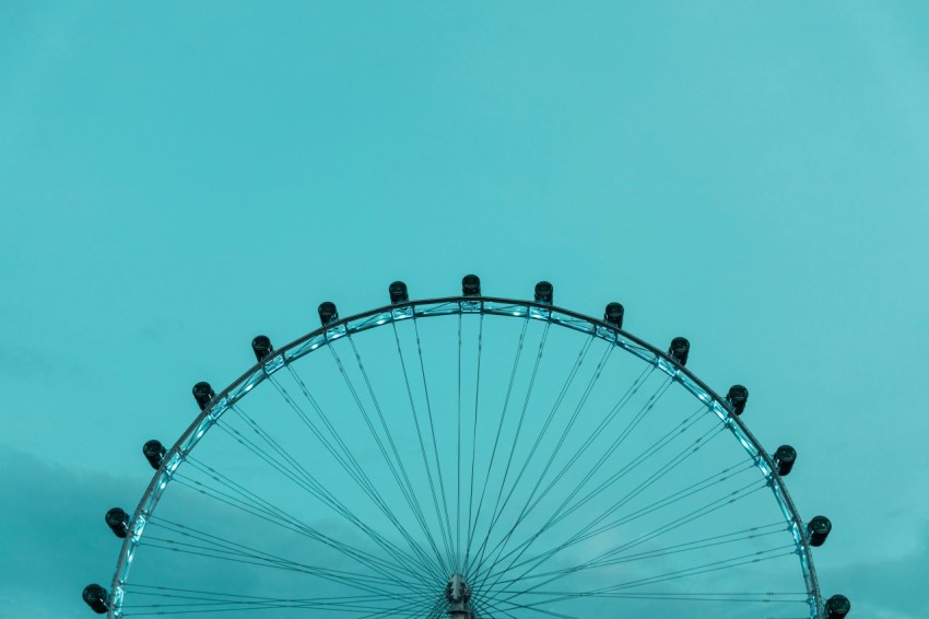 white and black ferris wheel under blue sky during daytime