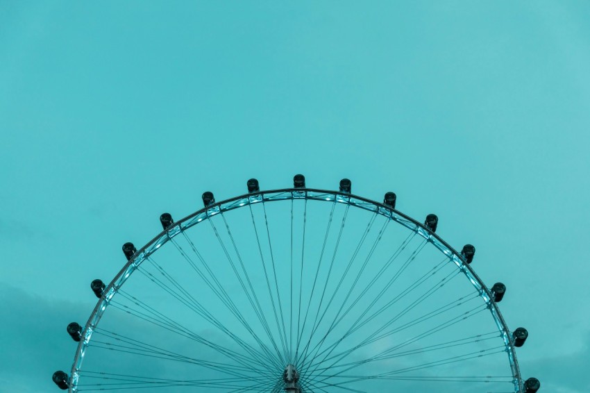 white and black ferris wheel under blue sky during daytime