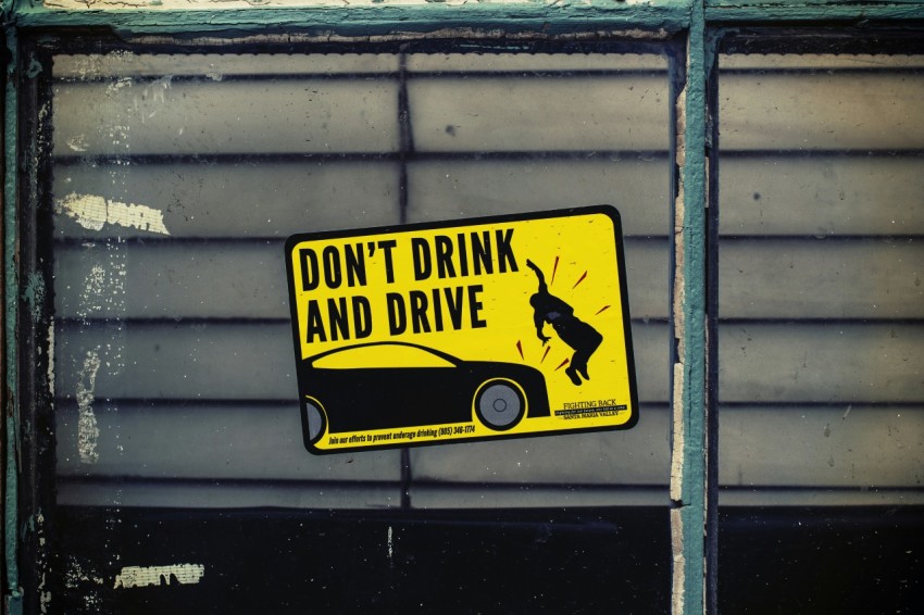 dont drink and drive poster on glass panel