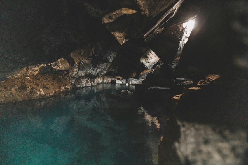 a body of water inside of a cave