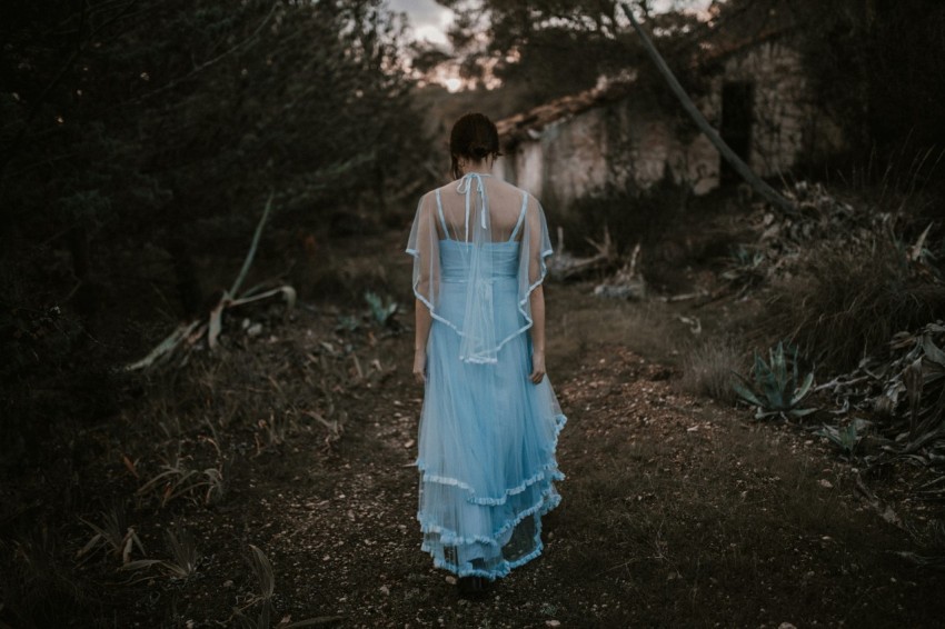 woman wearing blue dress during daytime