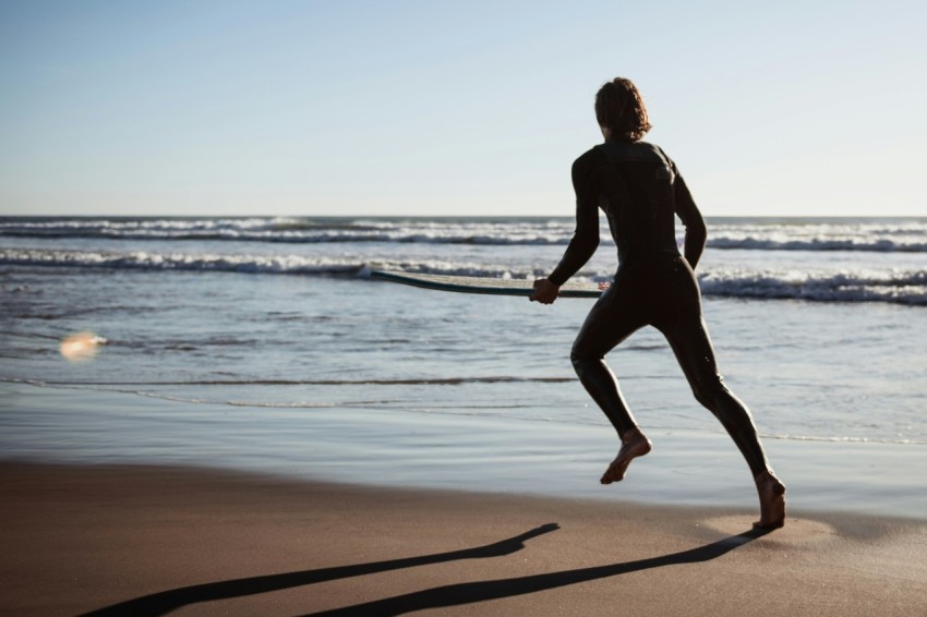 man running near ocean