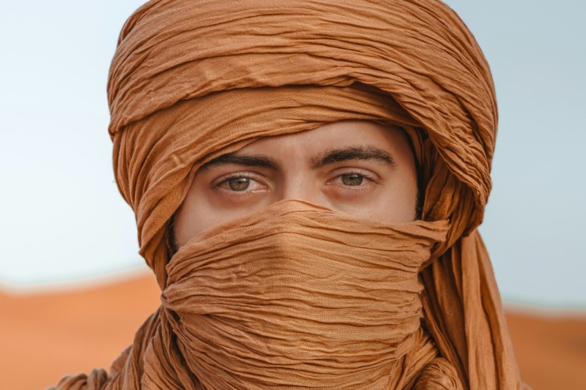 a man with a scarf wrapped around his head