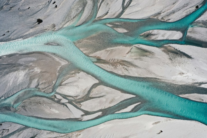 an aerial view of a river flowing through a valley