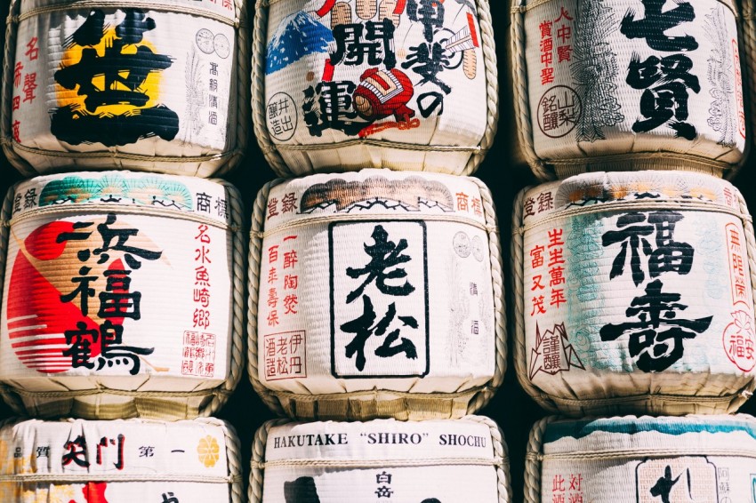 a pile of sake bottles with asian writing on them ebt0bO