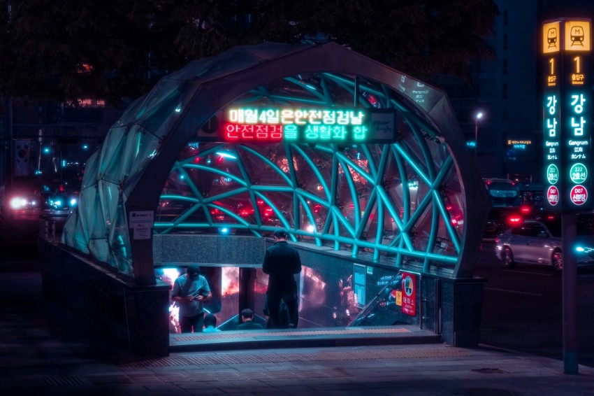 a man standing in a doorway of a building at night