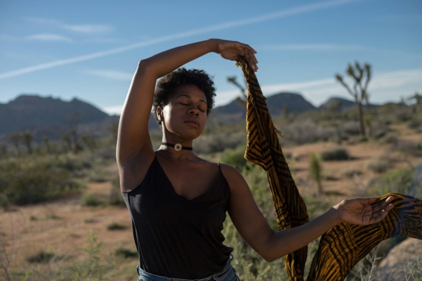 woman holding scarf with both hands