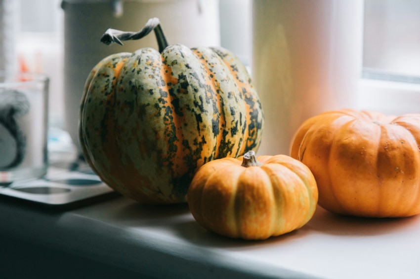 orange and green pumpkin on table