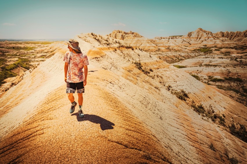 man walking on a rocky mountain