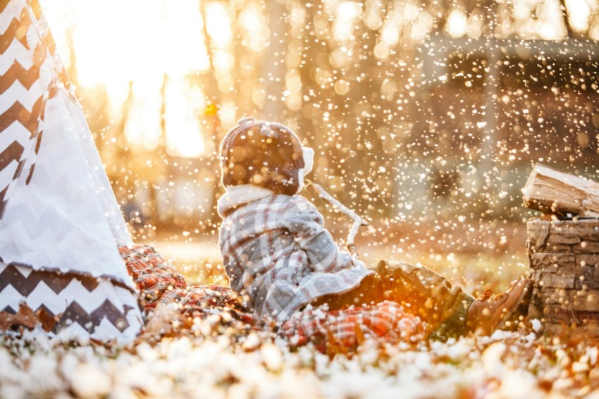 selective focus photography of child sitting on ground