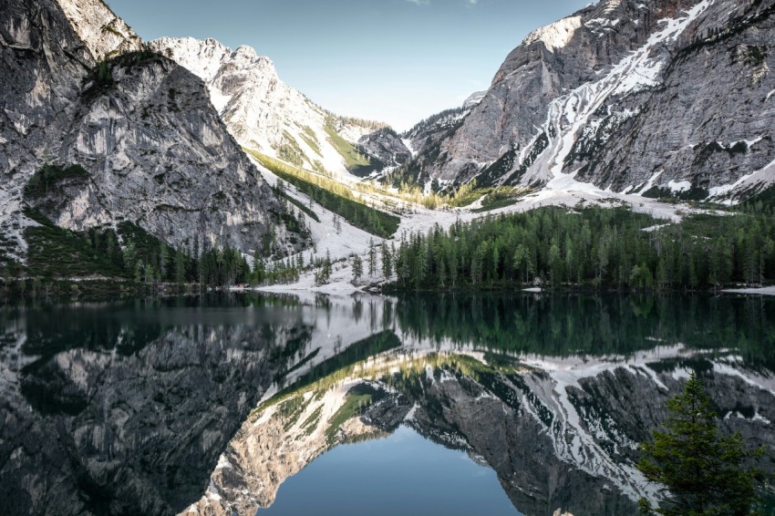 mountain reflected on body of water at daytime dXYMHj1