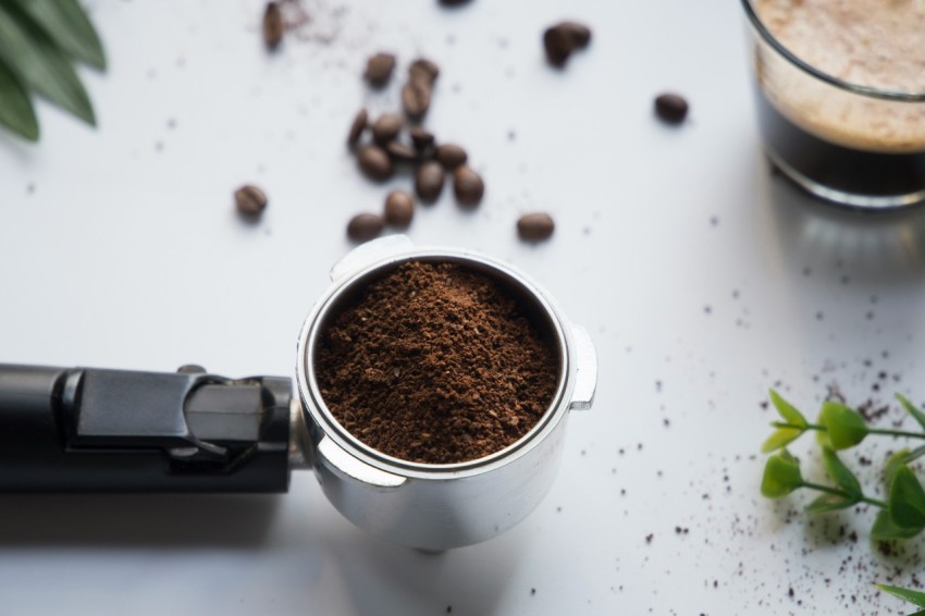 grained coffee in gray stainless steel container HkbjO