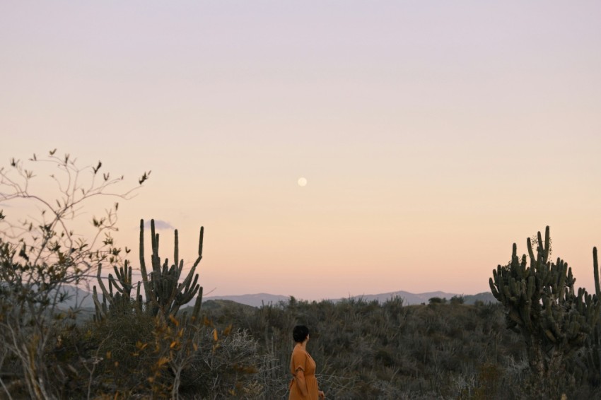 woman standing near trees