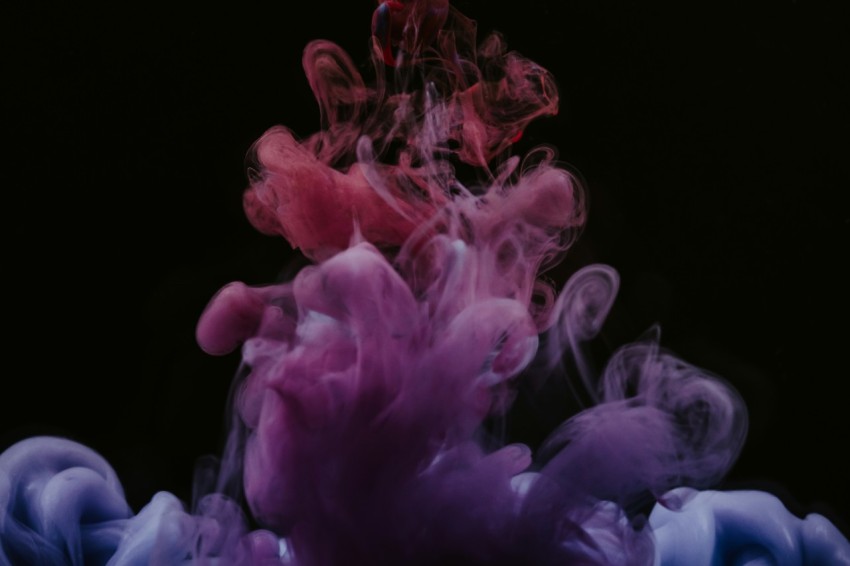 pink smoke in black background