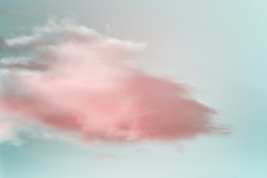 a pink cloud in a blue sky