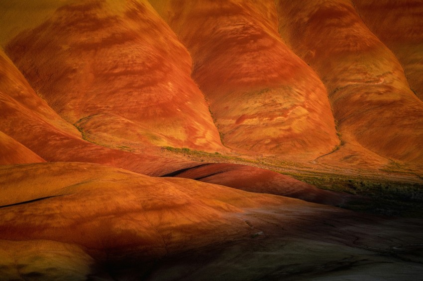 a painting of a desert landscape with hills in the background hA