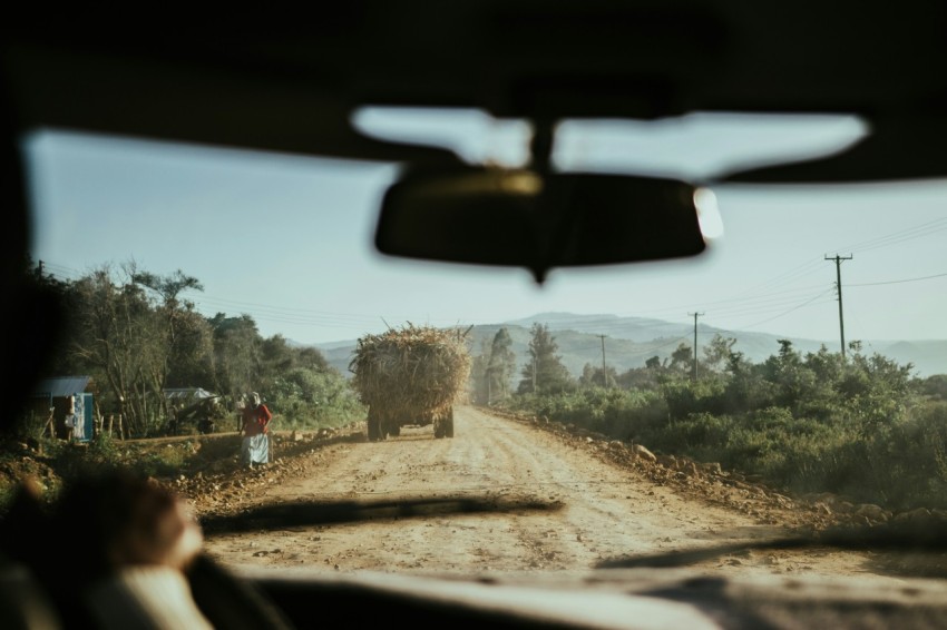 truck with hay on road at daytime kF1gb5ayB