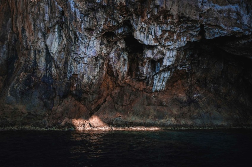 a cave with a body of water in it