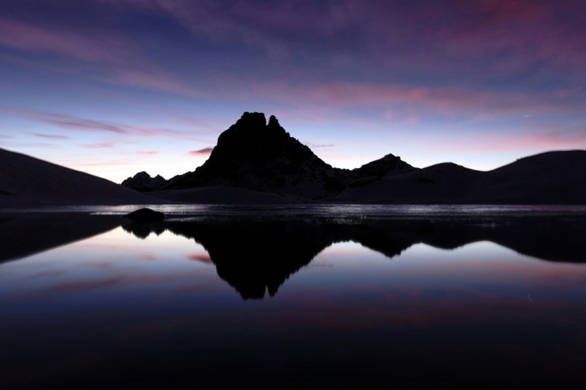 body of water near mountain during daytime 9vEd