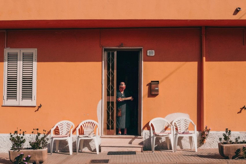 person standing beside door