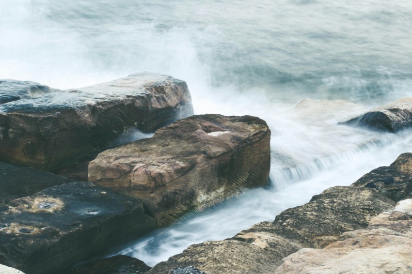 sea waves crashing on rocks