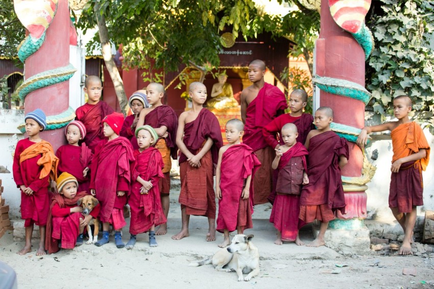 group of people wearing red traditional dress