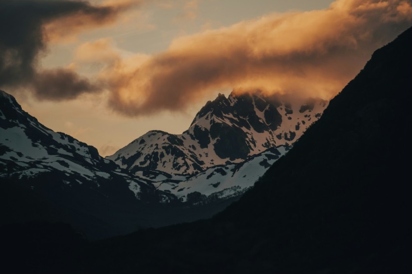 black and white mountains under cloudy sky during daytime