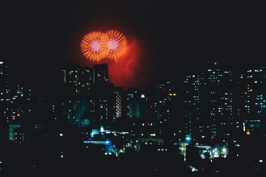 high rise buildings and fireworks display