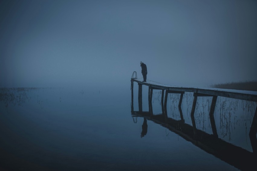 2 person standing on wooden dock in grayscale photography Age